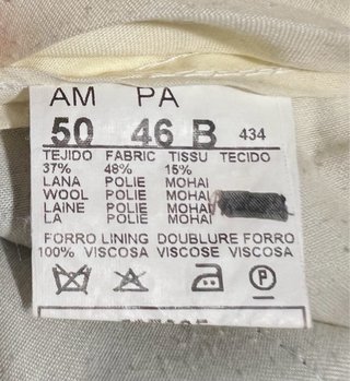 Talla 46. Pantalón de vestir gris con pinzas.