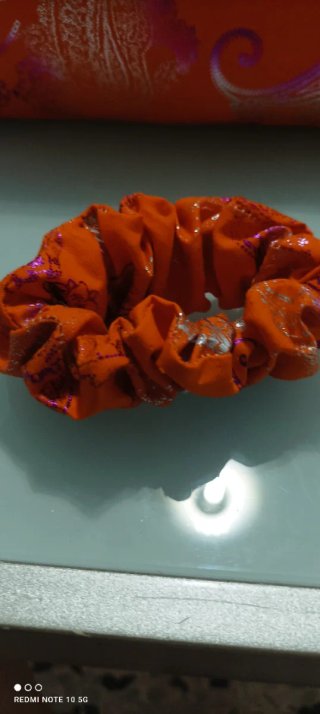 Pochette in tessuto arancione e viola