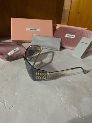 Occhiali Miu Miu Grigio