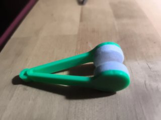 Limpiador de gafas verde y blanco
