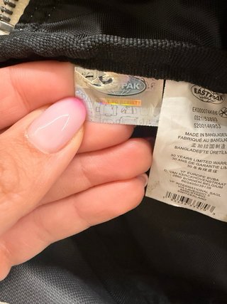 Riñonera Eastpak cuadros gris y rojo