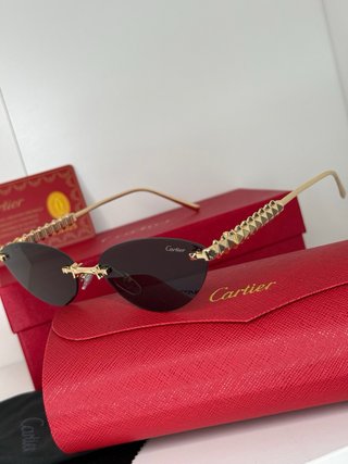 Gafas de sol Cartier doradas y marrones
