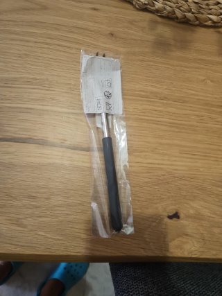 Rascador de espalda retráctil