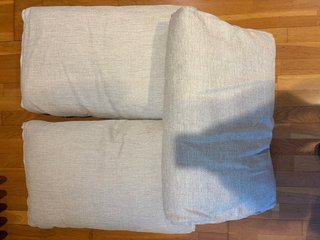 Cojín rectangular pequeño respaldo sofá gris
