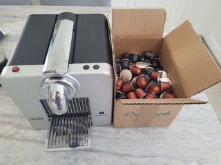 Cafetera+300 capsulas originales- Nespreso DeLongh