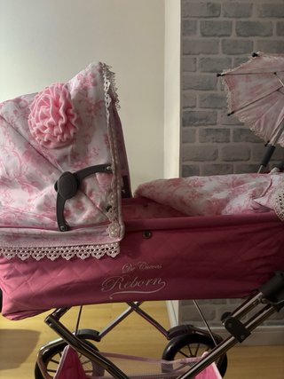 Carrito de muñecas rosa Reborn