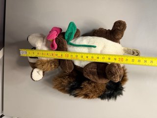 Peluche procione con fiore