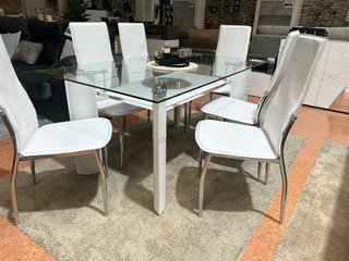 Mesa de cristal con 6 sillas blancas
