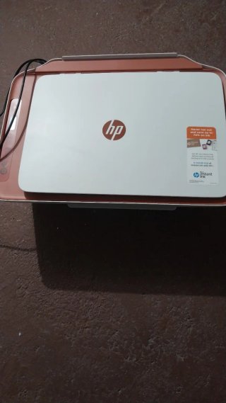 Impresora HP rosa y blanca