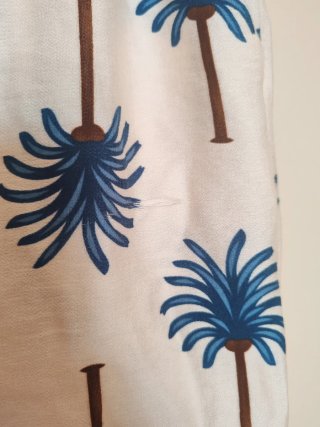Pantalón palazzo estampado palmeras