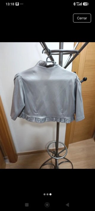 Bolero plateado con volantes