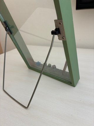 Cornice decorativa con giardino in miniatura