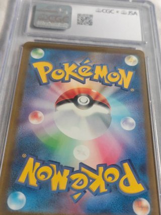 Charizard 2023 Autografiado por Arita