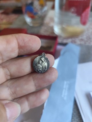 Medalla doble cara plata.
