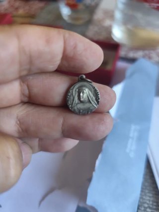 Medalla doble cara plata.