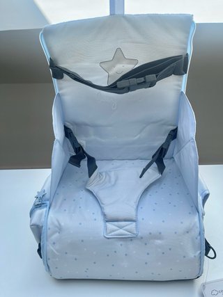 Trona de viaje con bolsillo a estrenar
