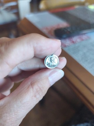 Antigua doble medalla de plata