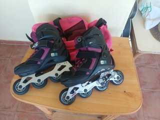 Patines línea Oxelo ajustables T37-40, bolsa rosa