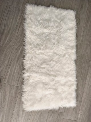 Alfombra de lana blanca