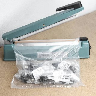 Selladora de bolsas metálica resistente.