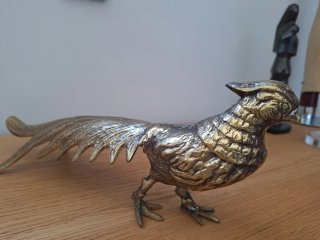 Pájaro de bronce decorativo