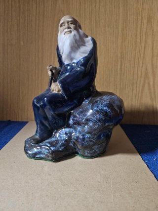 Figura porcelana anciano sabio con bastón
