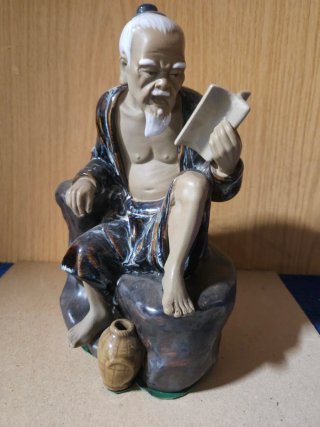 Figura porcelana anciano leyendo
