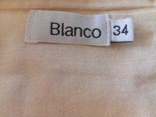 Falda dorada y blanca con cinturón