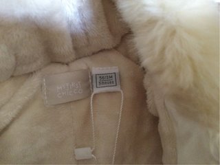 Buzo para bebé Chicco blanco con capucha