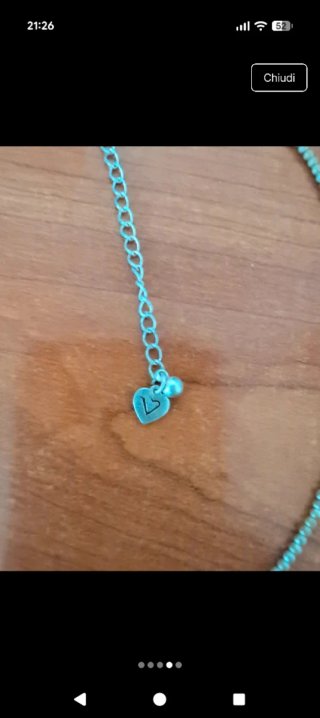 Collana con ciondoli a forma di luna e stelle