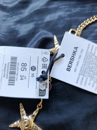 Cinturón Bershka estrellas de mar doradas