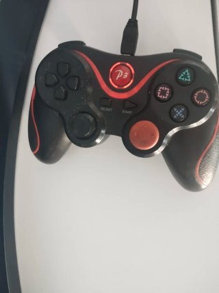 Consola PS3 con mando y juego