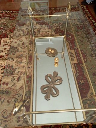 Mesa de centro cristal y metal dorado
