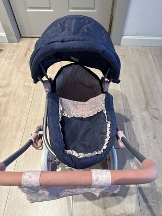 Carrito de bebé de juguete azul