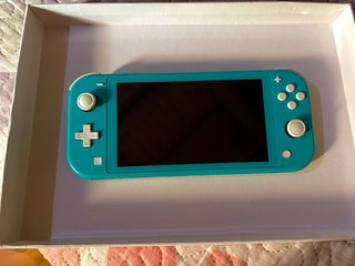 Nintendo Switch Lite turchese + 5 giochi + scatola