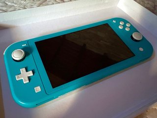Nintendo Switch Lite turchese + 5 giochi + scatola