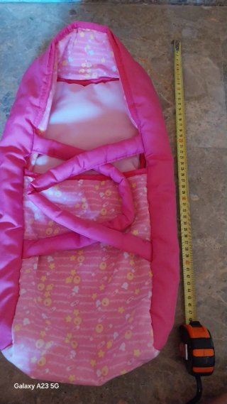 Carrito de bebé de juguete rosa