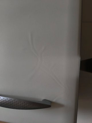 Mueble de cocina y encimera de piedra.