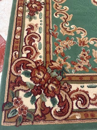 Alfombra de tela verde y beige