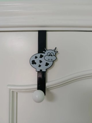 Colgador de puerta con diseño de vaca