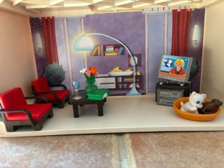Casa Playmobil con figuras y accesorios.