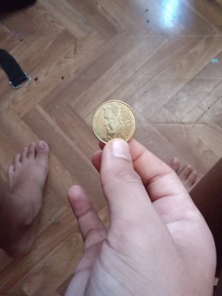 Moneda antigua con perfil