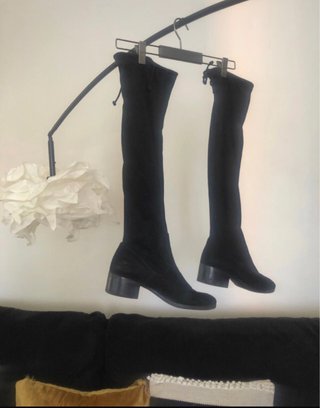 Botas altas ante Zara