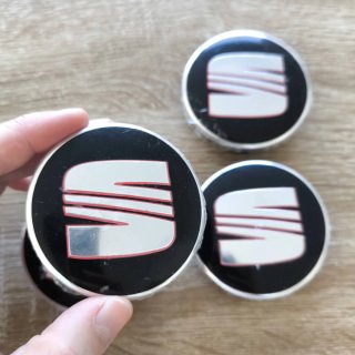 TAPABUJES SEAT 63mm NEGROS CON EMBLEMA PLATA ROJO