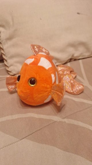 Peluche dinosaurio rojo y pez naranja