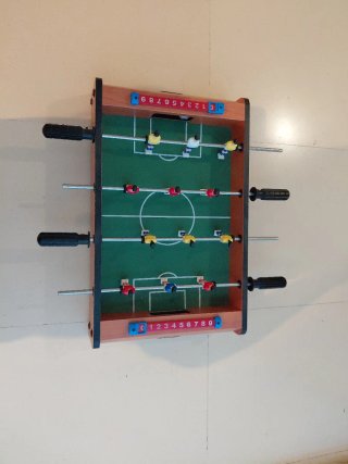 Futbolín de mesa con marcadores
