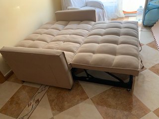 Sofá-cama beige manual