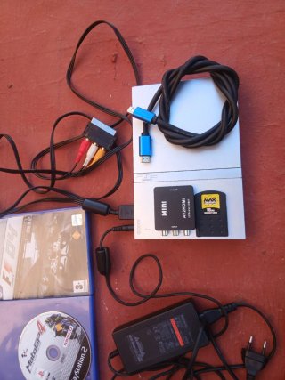 Console PlayStation 2 con giochi e accessori