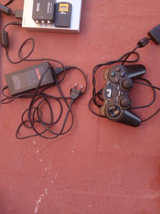 Console PlayStation 2 con giochi e accessori