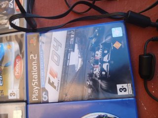 Console PlayStation 2 con giochi e accessori